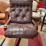 Scandinavian tilting and rotating armchair