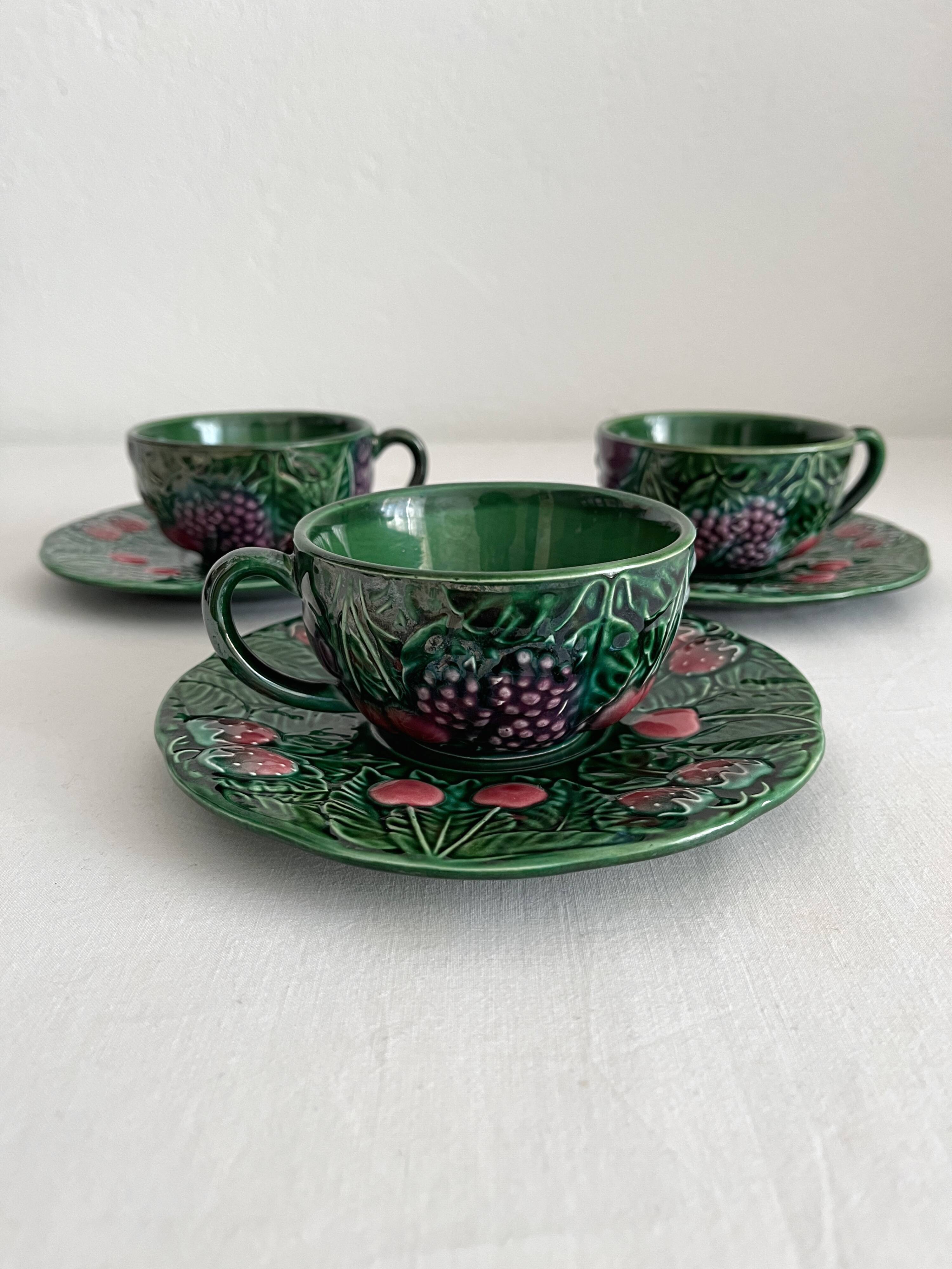 3 earthenware cups and saucers in barbotine fruit decor Salins vintage