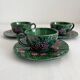 3 earthenware cups and saucers in barbotine fruit decor Salins vintage