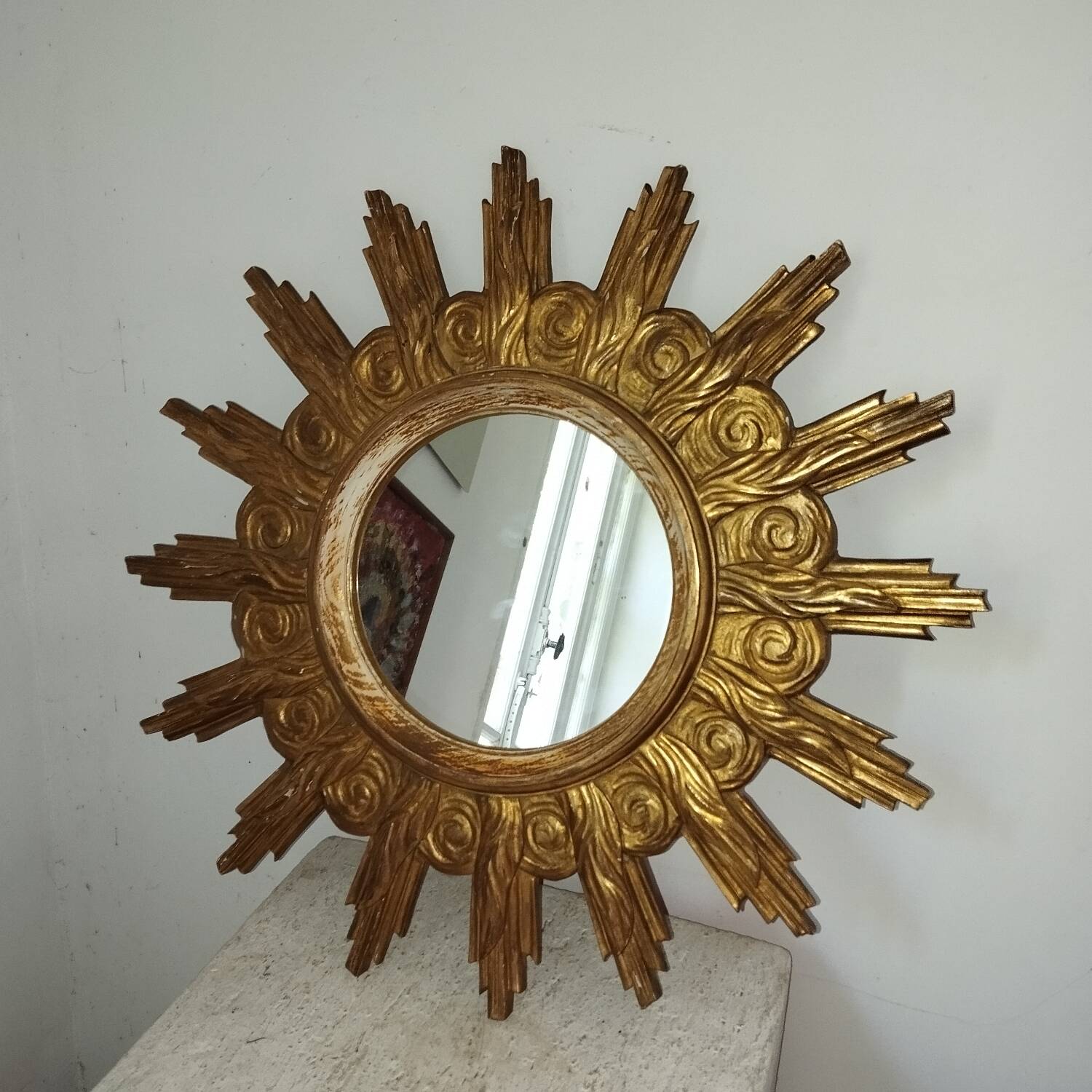 Miroir soleil bois sculpté doré