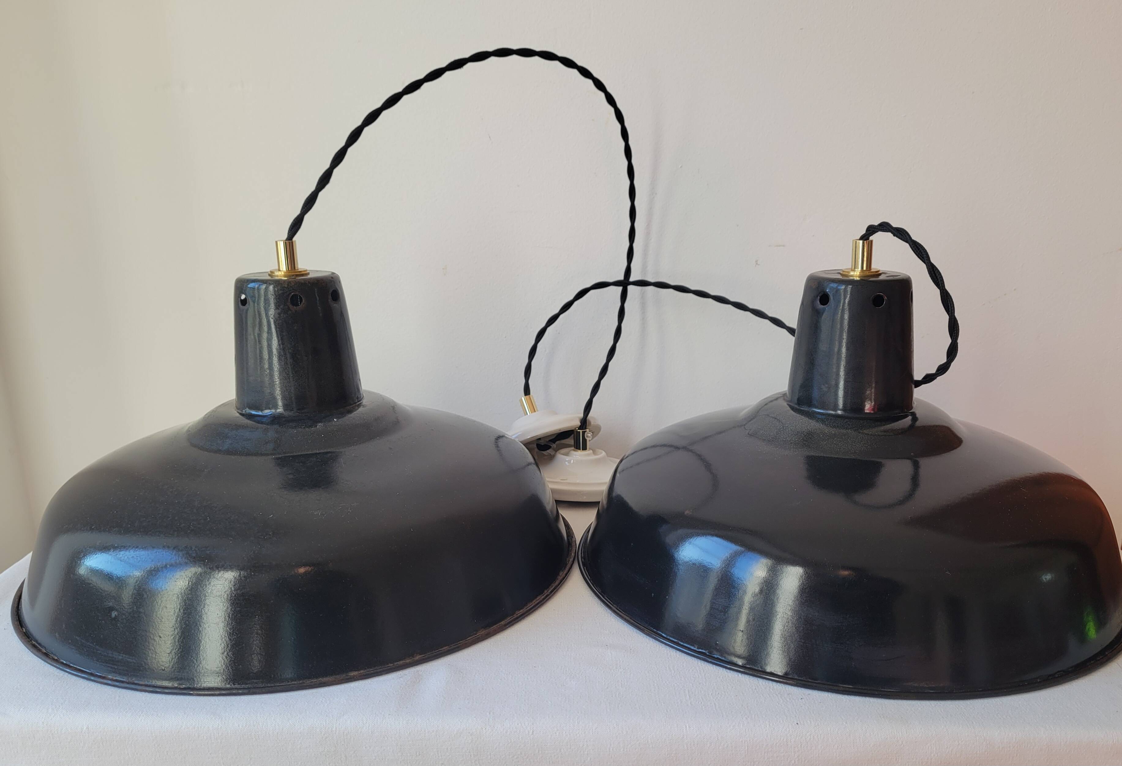 Duo of white and black enameled sheet metal pendants