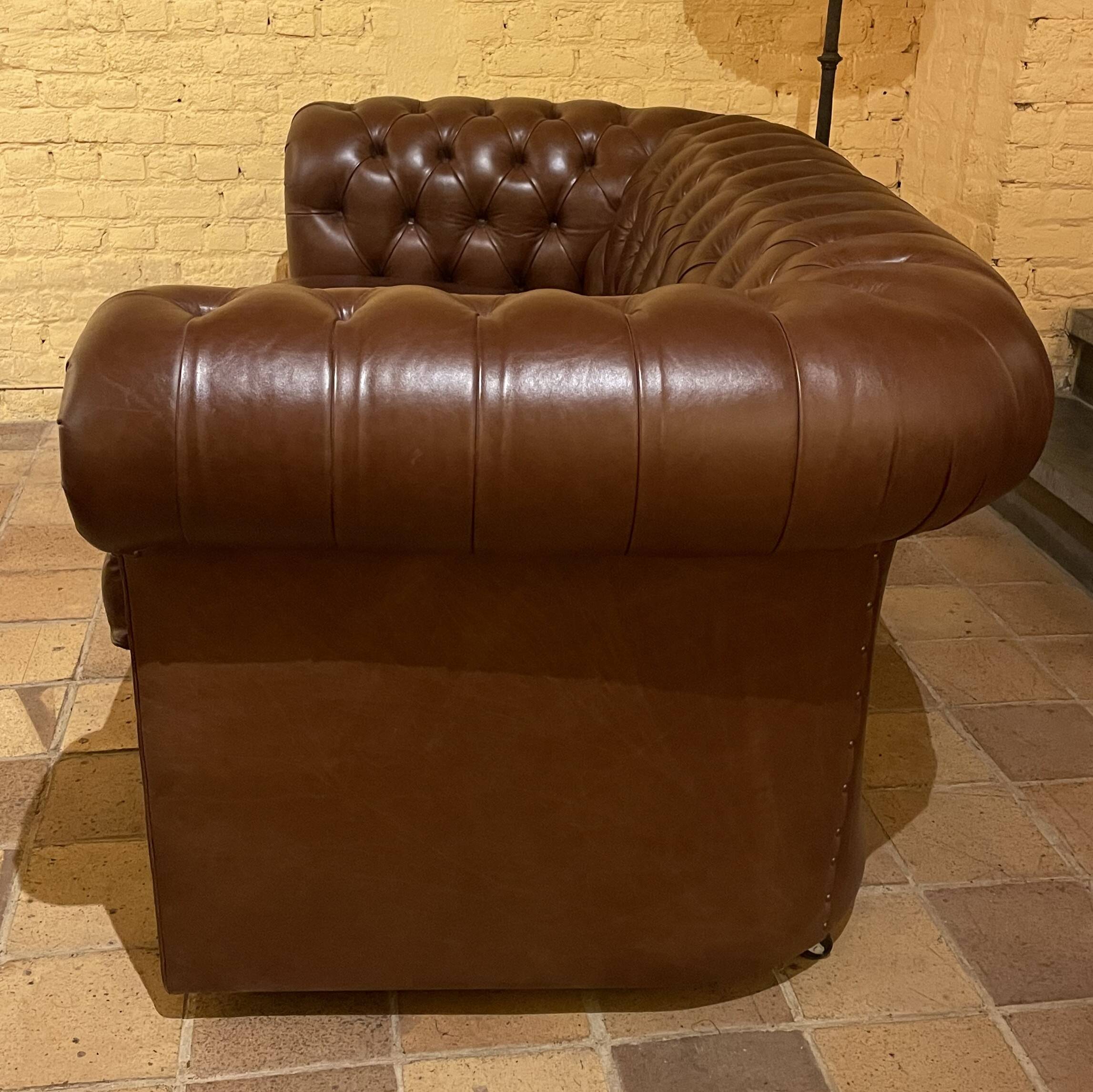 brown leather 2-seater Chesterfield sofa