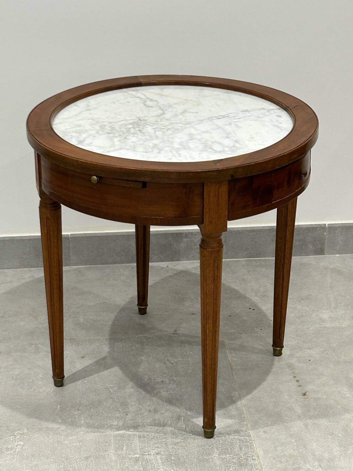 Low bouillotte side table with a pull and drawers.