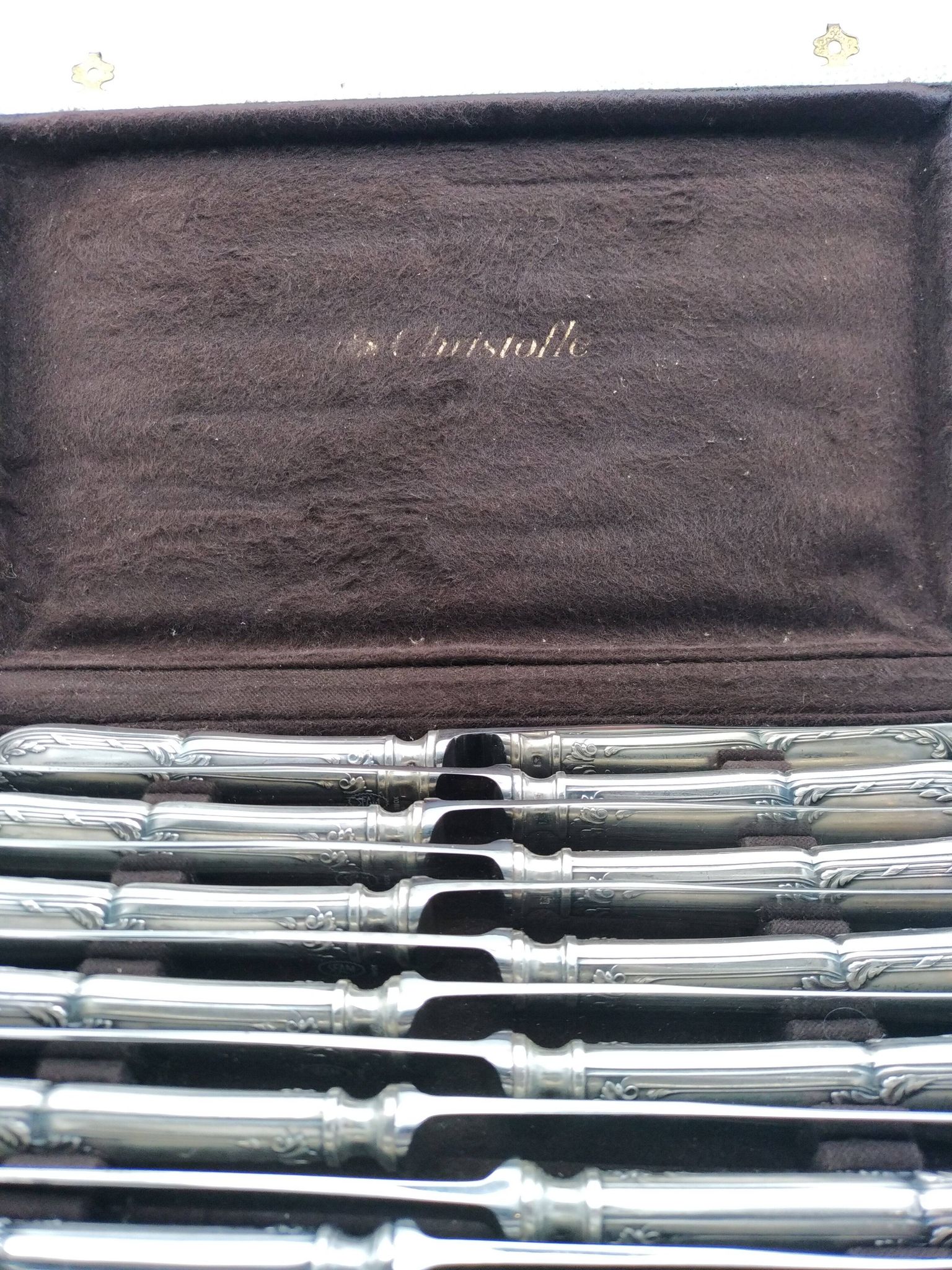 Set of 12 sfam knives in silver metal and stainless steel blades.