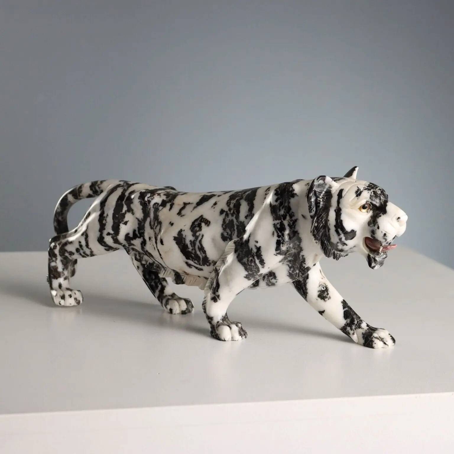 Ancient sculpture of a black and white marble panther, 20th century.