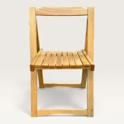Blonde wooden folding chair in the style of Aldo Jacober.