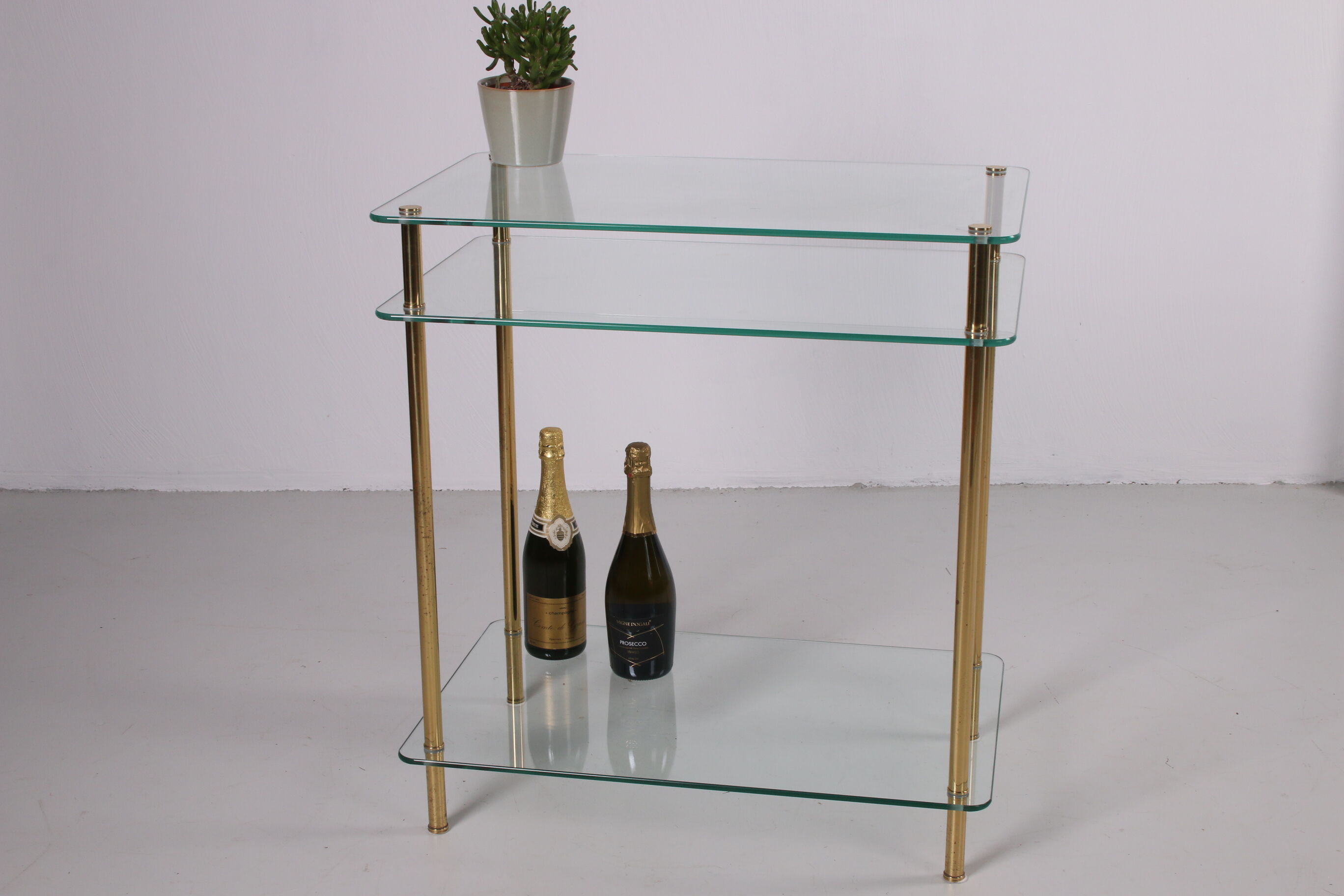 Hollywood Regency side table with gold-colored legs