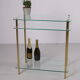 Hollywood Regency side table with gold-colored legs