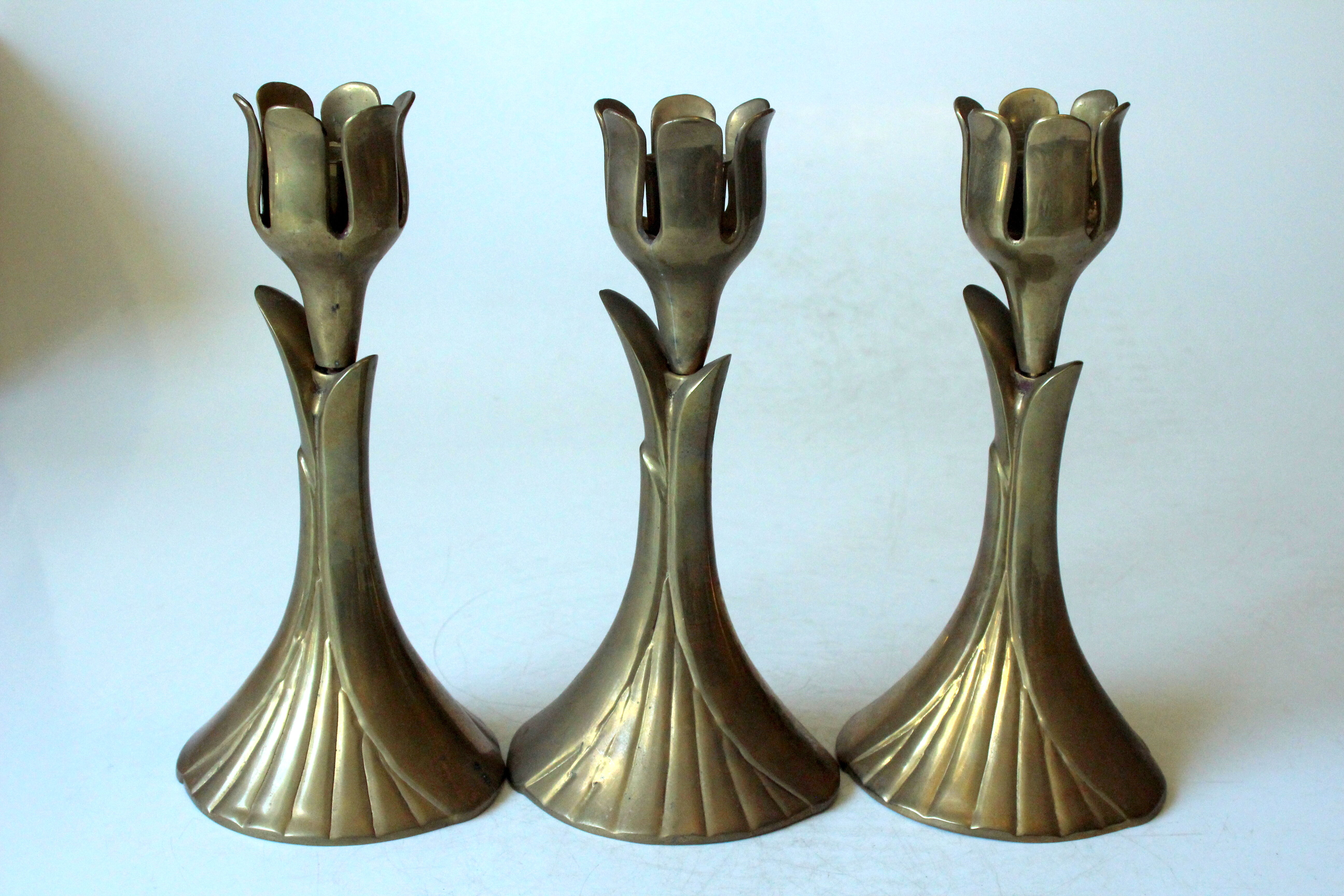 3 beautifull solid brass candle holders with floral motif, vintage from the 1960s