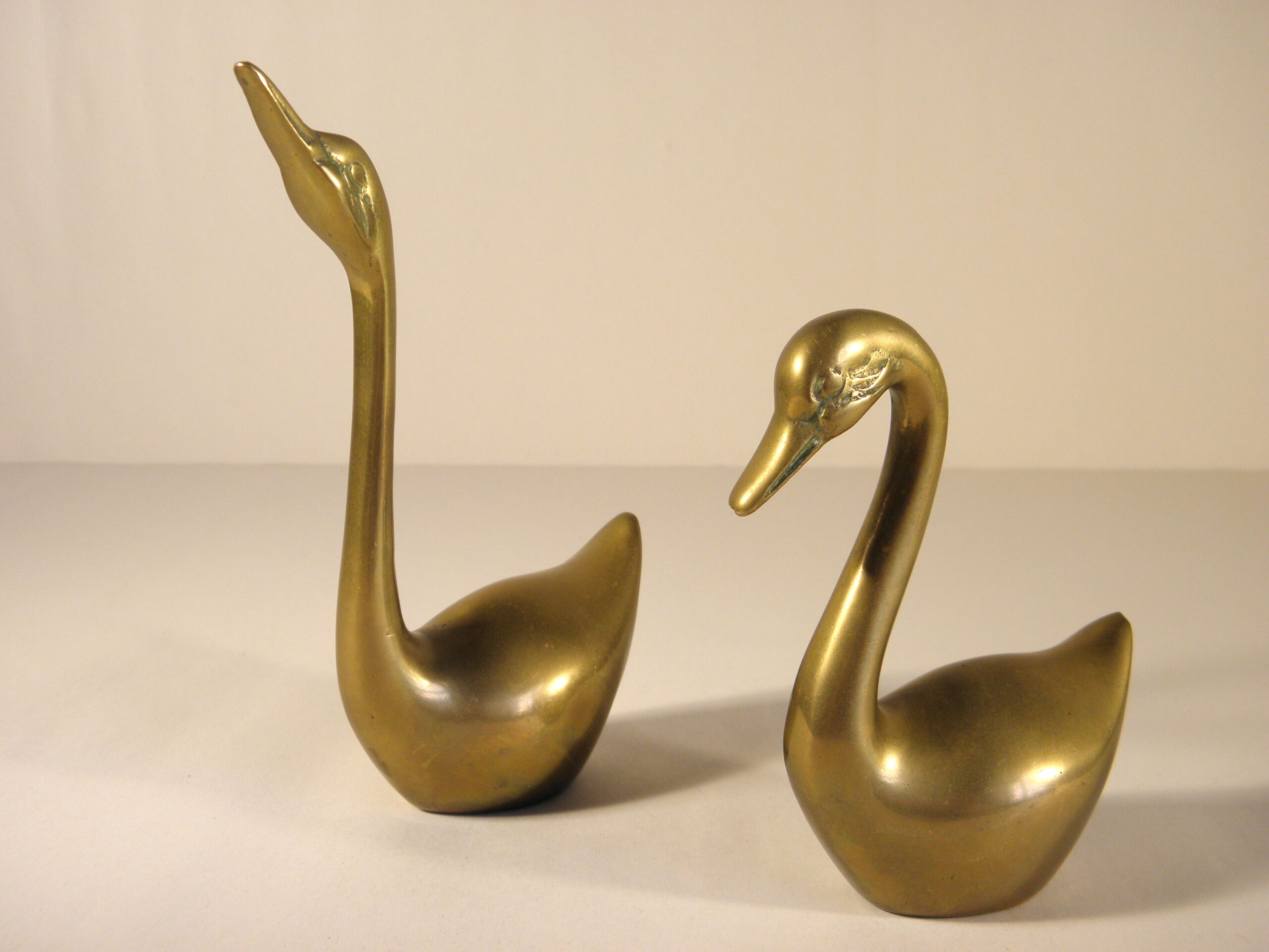 Pair of brass swans