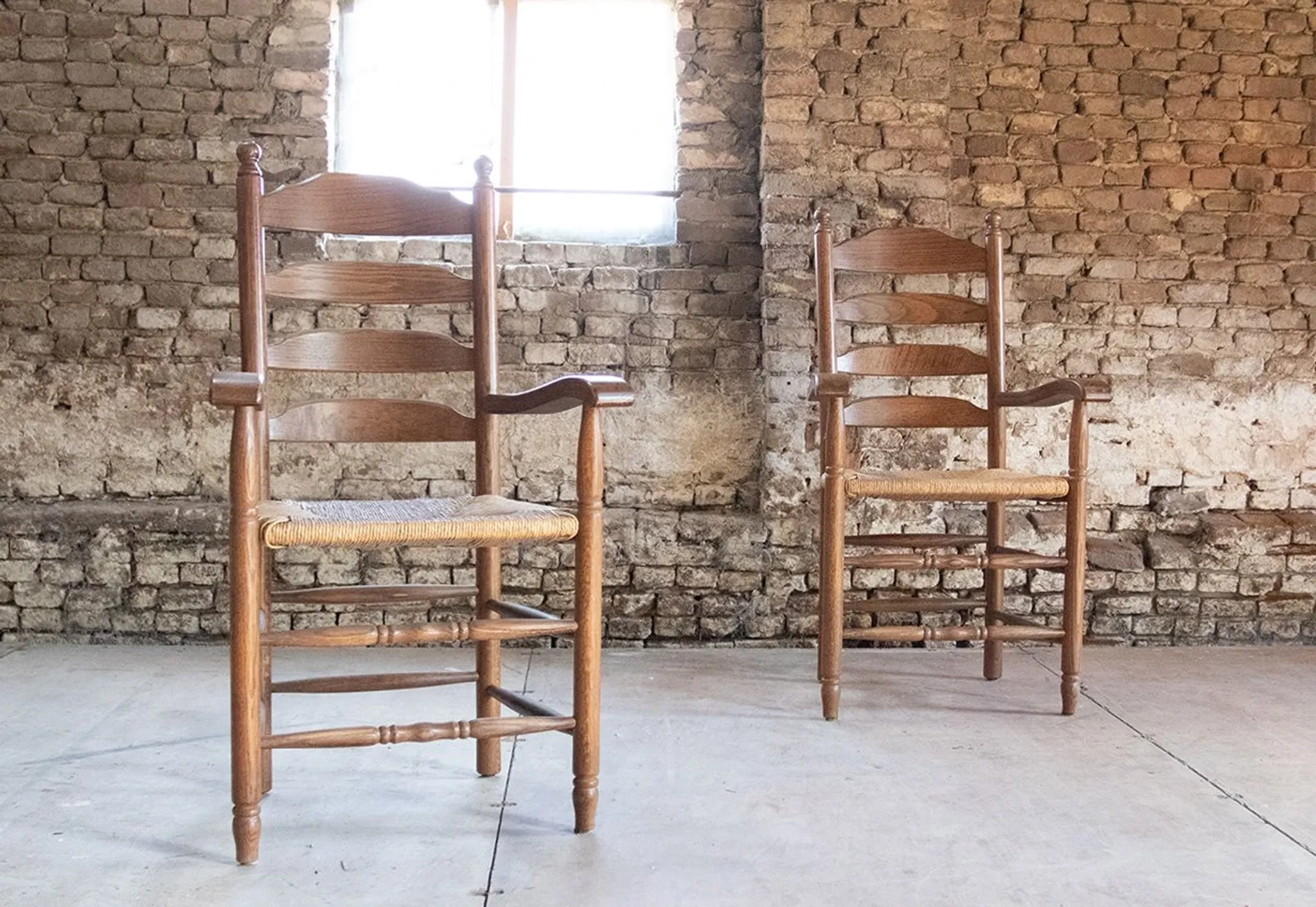 Pair of Dutch oak ladderback armchairs with rush seats – 1960s