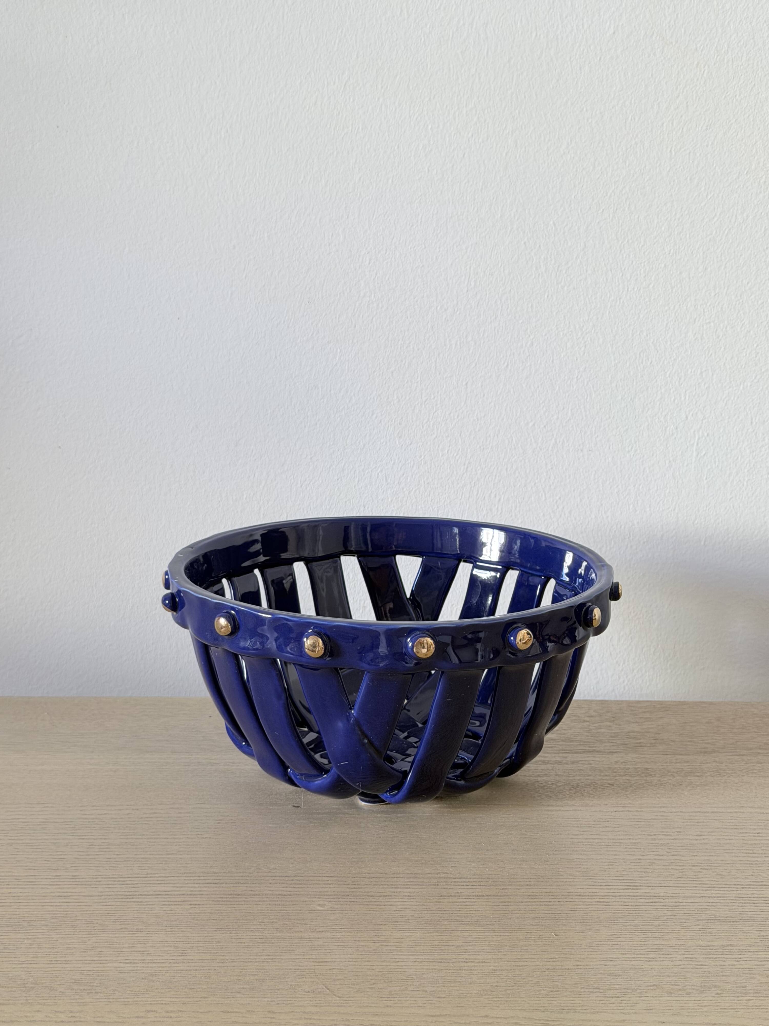 Large cobalt blue openwork bowl with golden studs