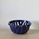 Large cobalt blue openwork bowl with golden studs
