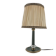 Brass table lamp with green patina and empire-style fabric shade.