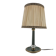 Brass table lamp with green patina and empire-style fabric shade.