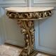 Carved wooden and marble console