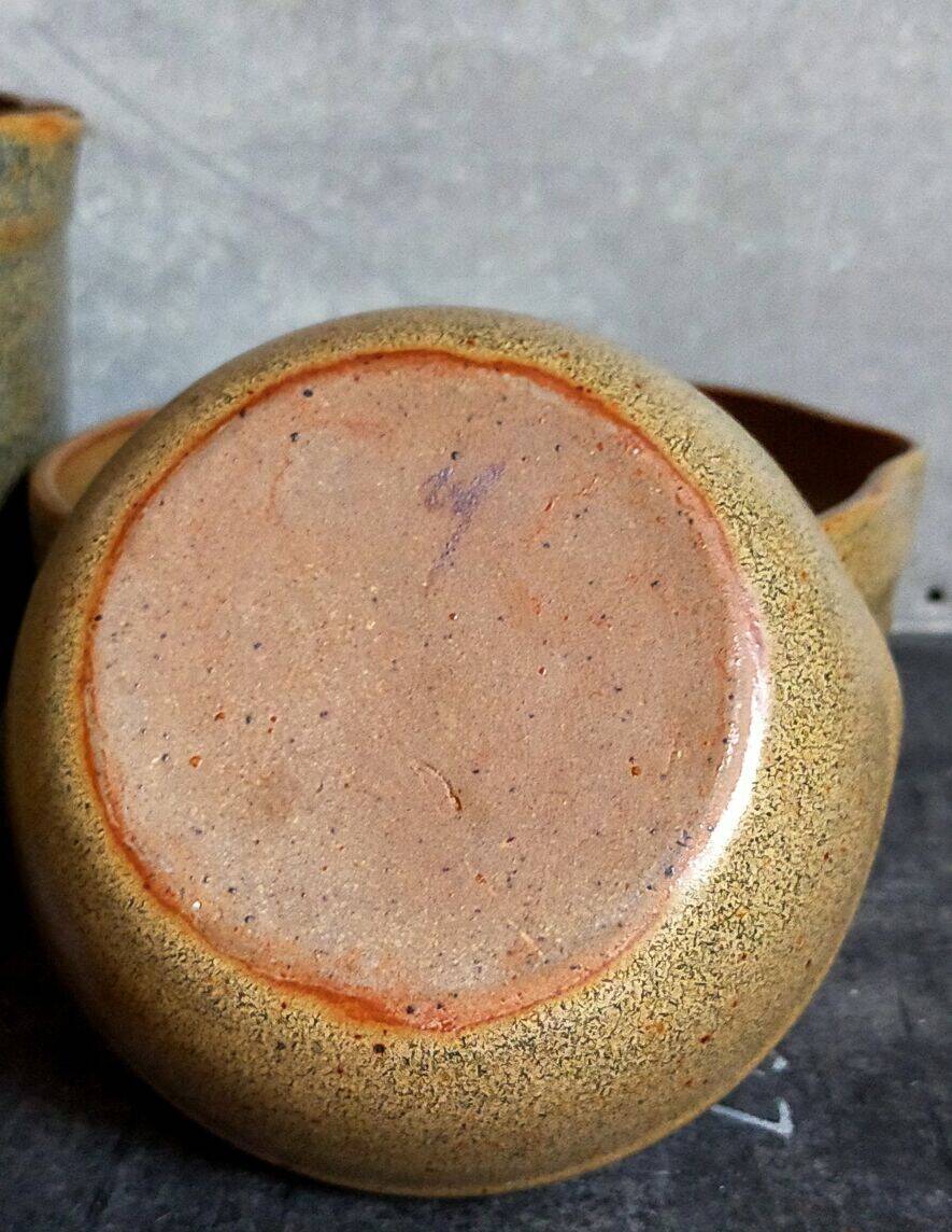 Three nesting pottery salad bowls in glazed stoneware