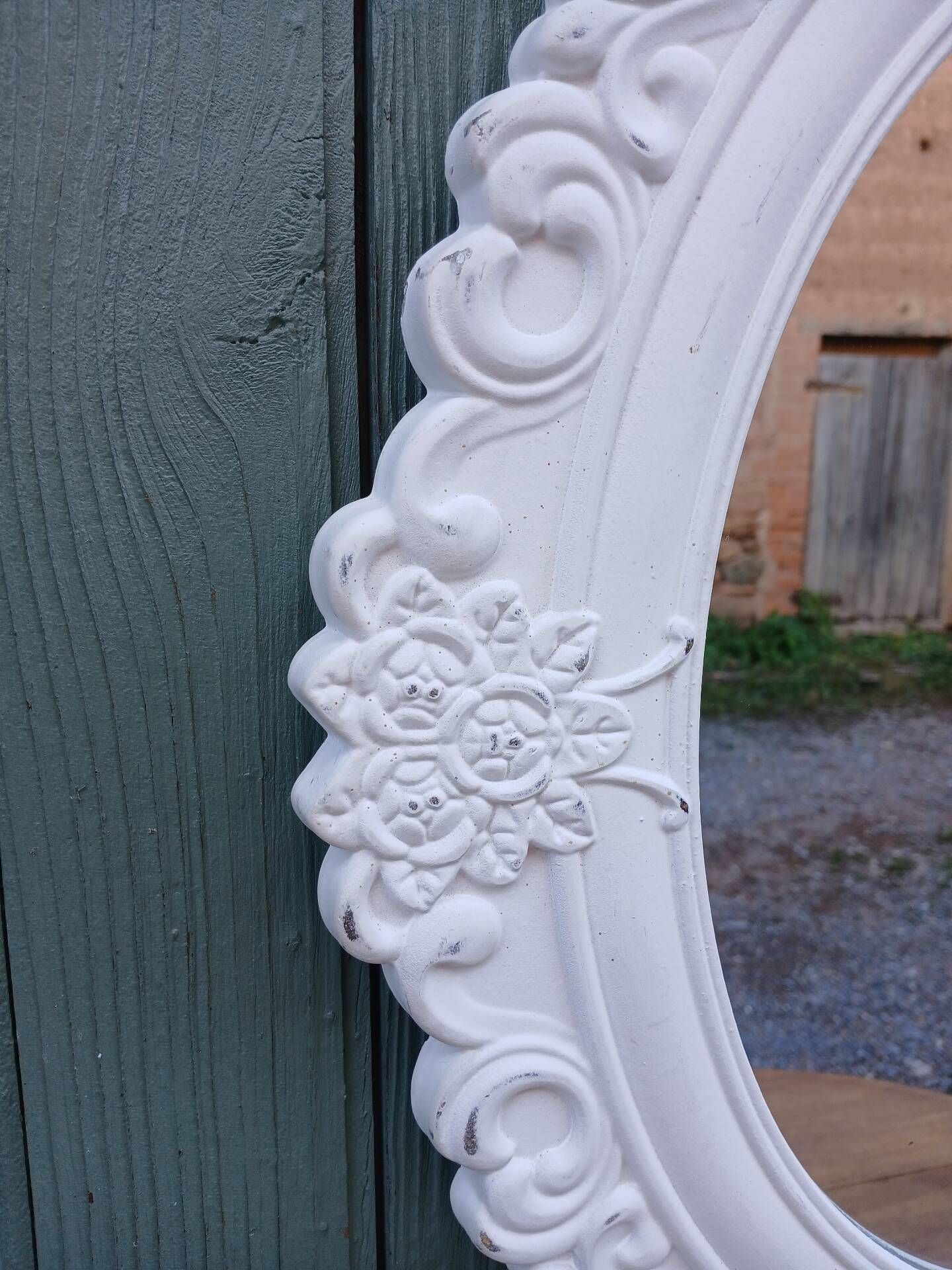 Oval mirror with white frame