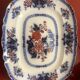 Large hollow dish in fine earthenware with Japanese decoration.