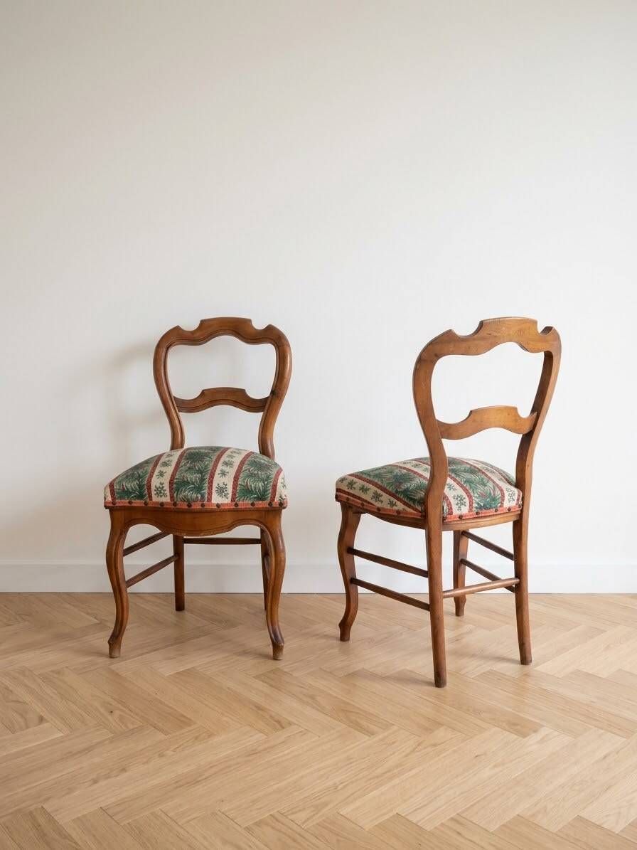Pair of antique Louis XV style chairs in wood and floral fabric.