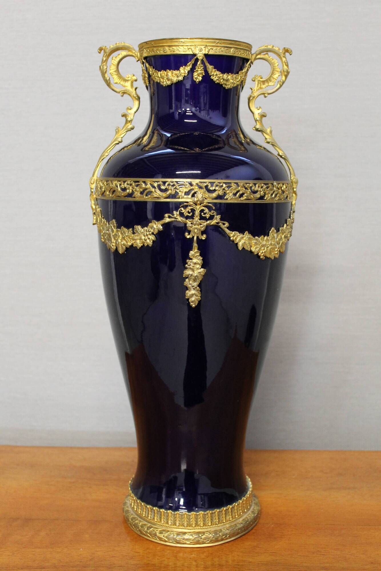 Vase signed Legastelois in blue ceramic of Sèvres and gilded bronze