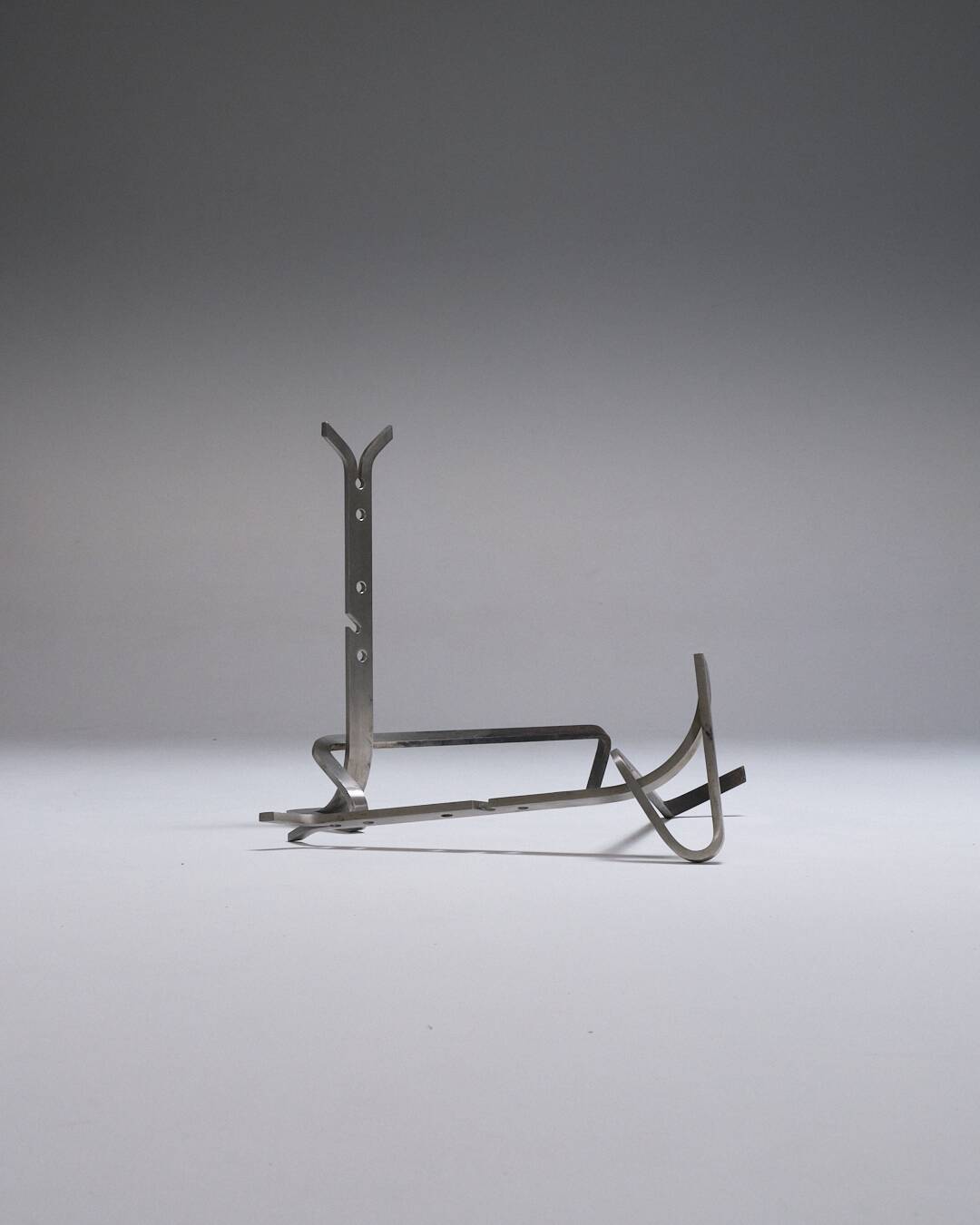 Pair of modernist brushed steel andirons, 1970s