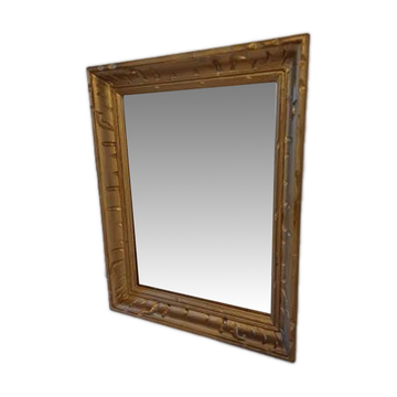 Wooden mirror and gold trim