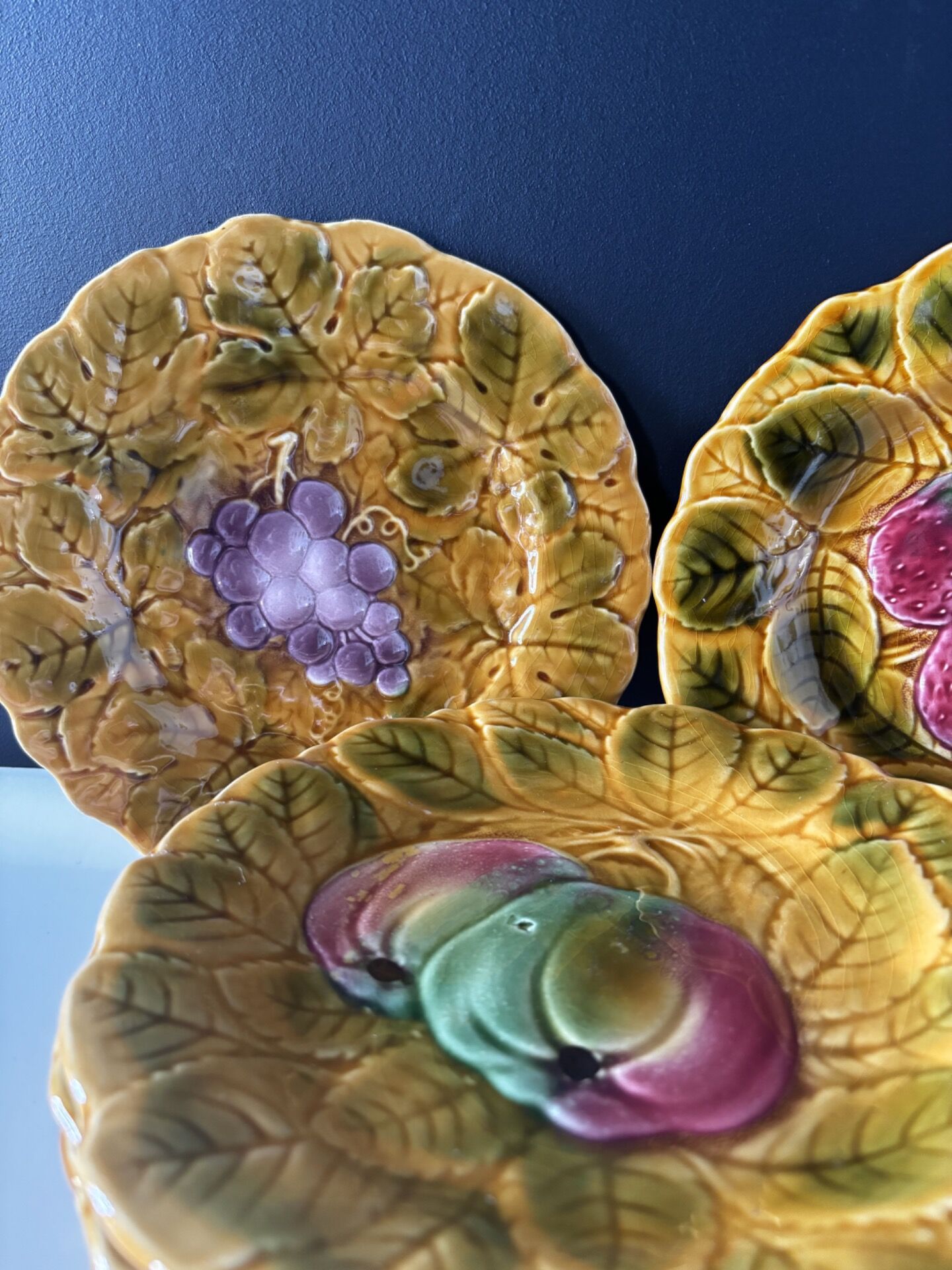 Set of 8 Sarreguemines barbotine plates — relief fruit decoration