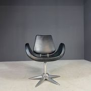 Alipes black swivel salon chair with chrome star base by Giorgetto Giugiaro