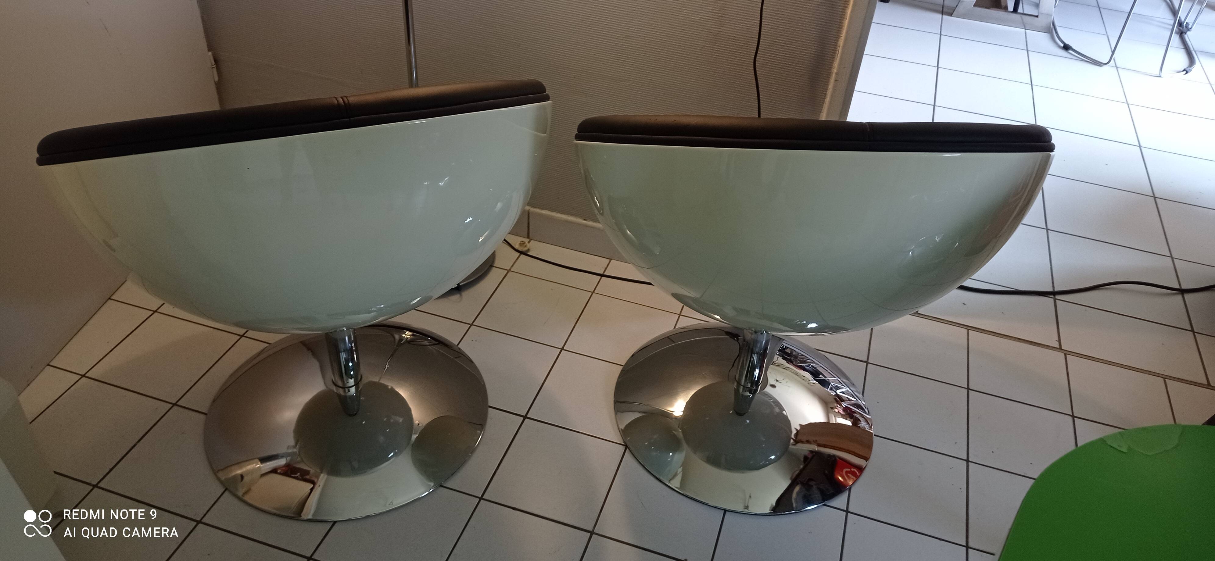 Pair of vintage white ball and black imitation leather swivel armchairs