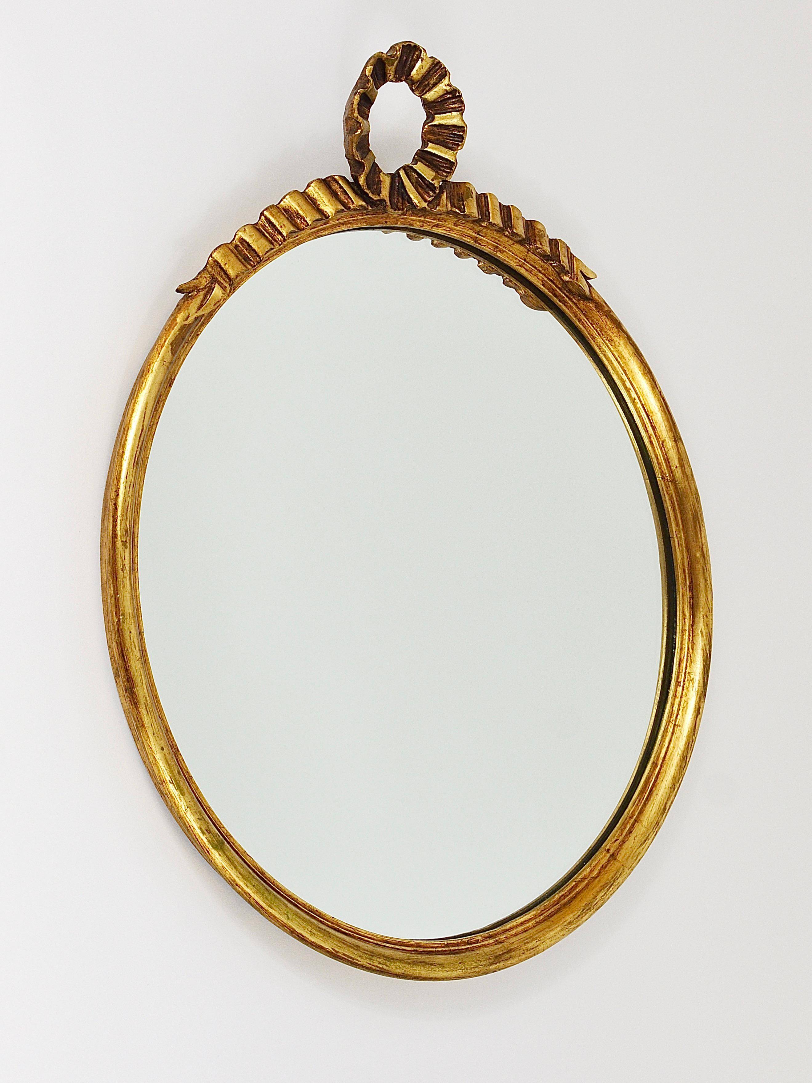 Round wall mirror in gilded wood, mid-century, C. Allodi & G. Subelli, Italy, 1950s.