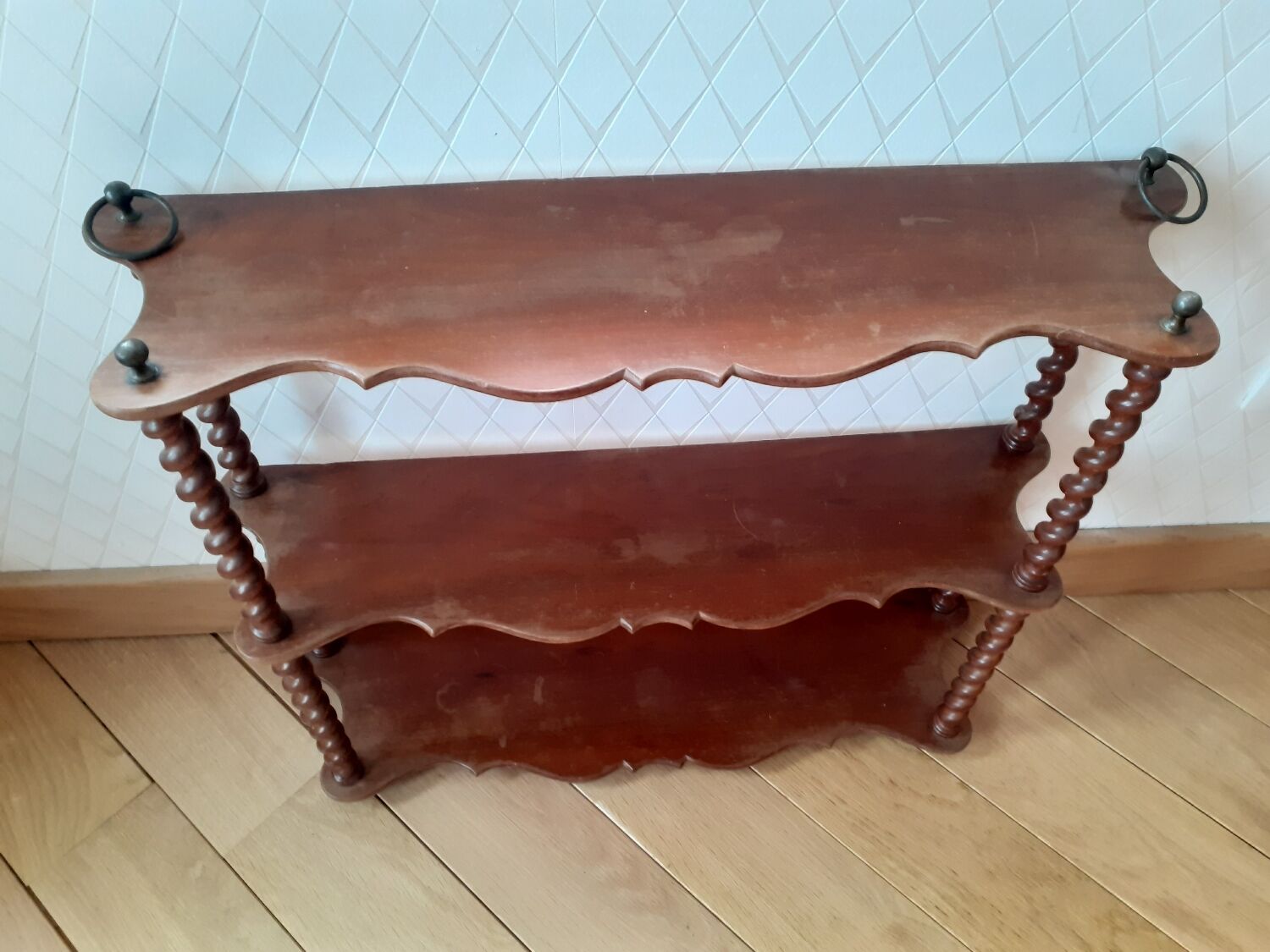 Turned wooden wall shelf