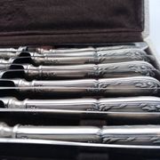 Set of 12 sfam knives in silver metal and stainless steel blades.