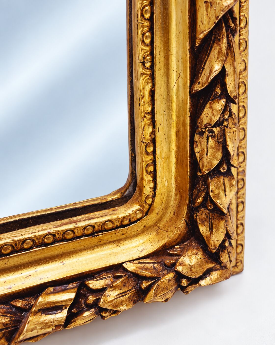Large gold full-length mirror with ornate crest