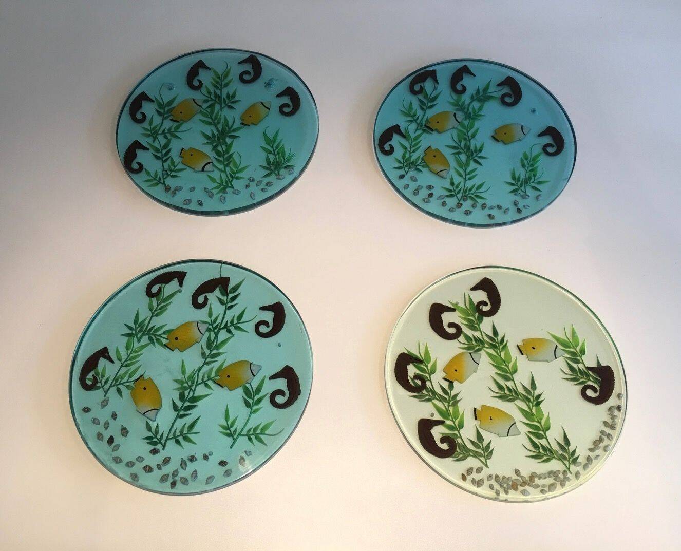 Set of 4 resin trays, inlaid with seahorses, fish, seaweed, and shells.