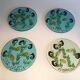 Set of 4 resin trays, inlaid with seahorses, fish, seaweed, and shells.
