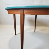 Extendable oval teak dining table