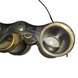 Old brass binoculars with integrated compass