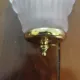 Pair of Art Deco shell wall sconces in frosted glass and brass.