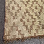 Vintage Touareg mat made of leather and reeds.