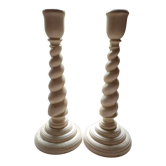 Pair of twisted wooden candle holders.