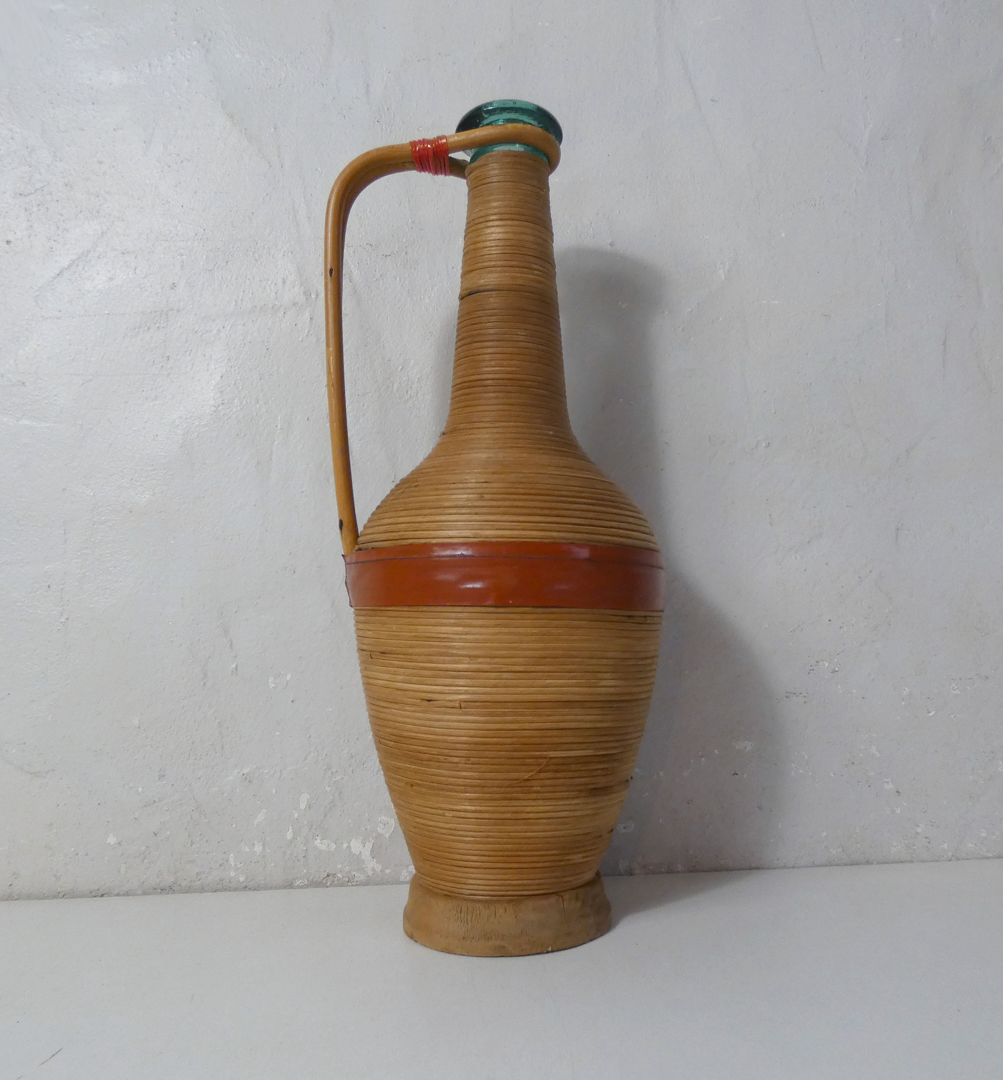 Old bottle dressed in vintage wood rattan