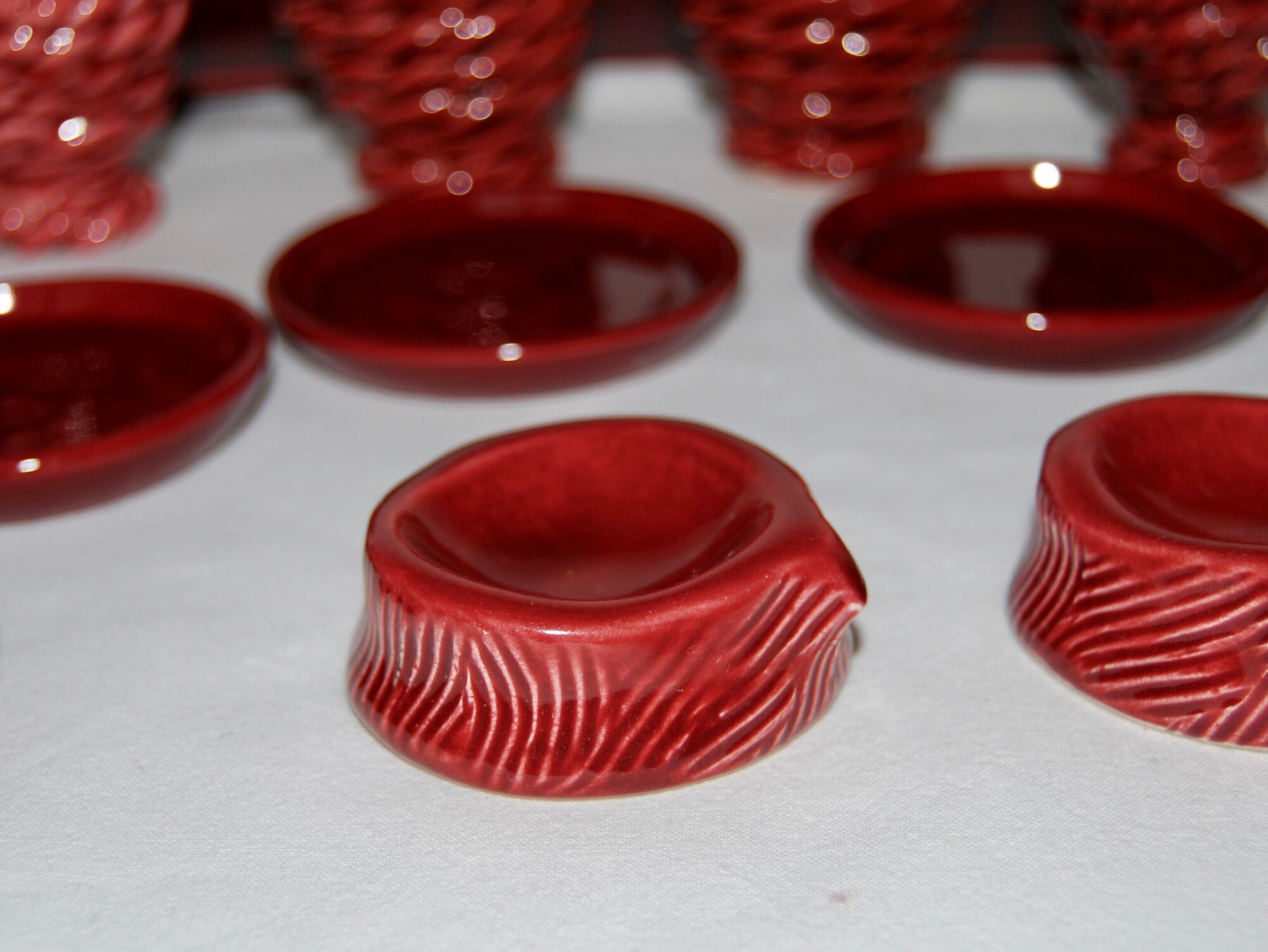 Set of 7 eggcups by Louis Bacculini, Vallauris, with 2 cups of salt, 6 saucers