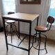 Set of two bar stools in wood and metal, industrial style.