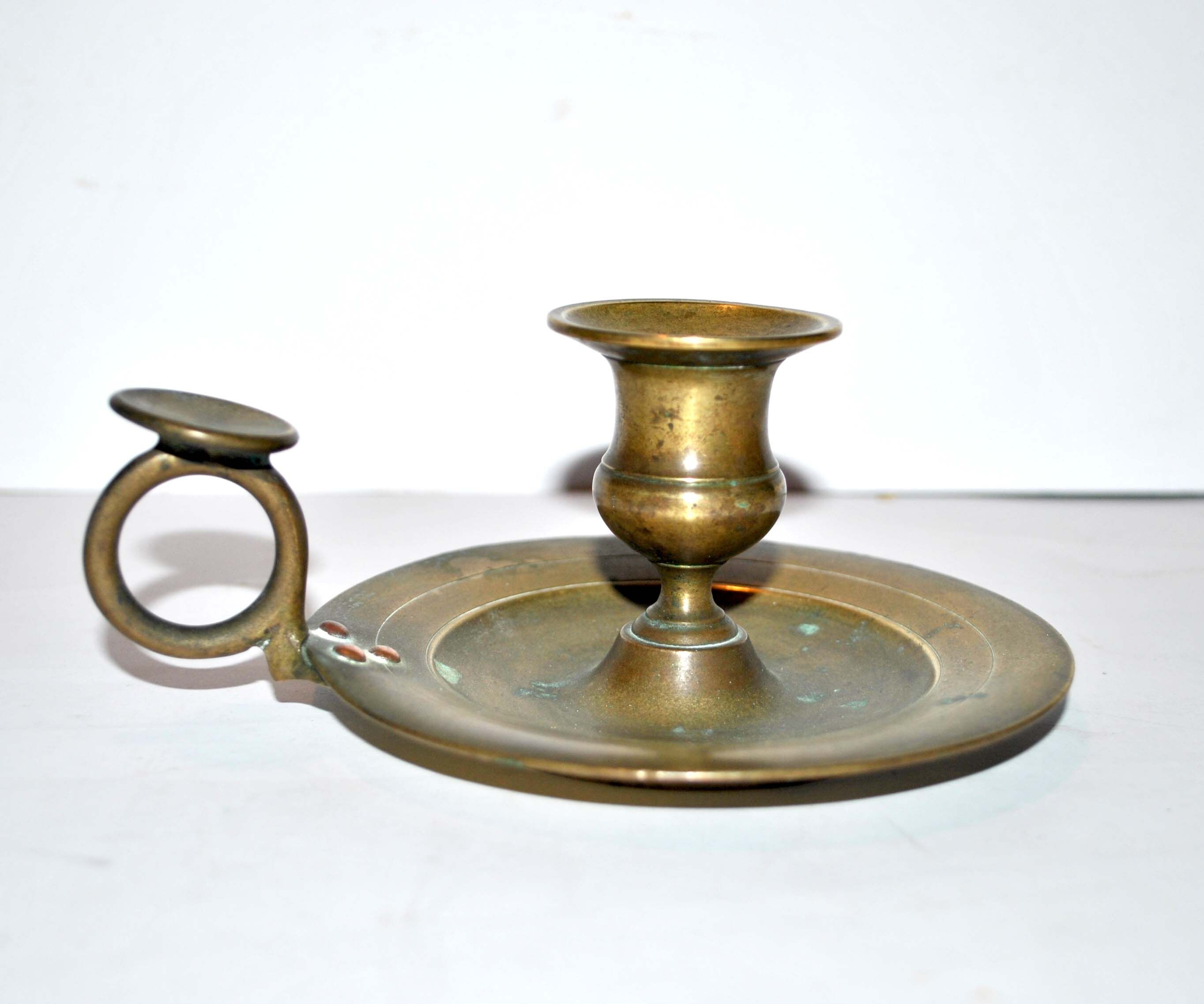 Bronze hand candle holder