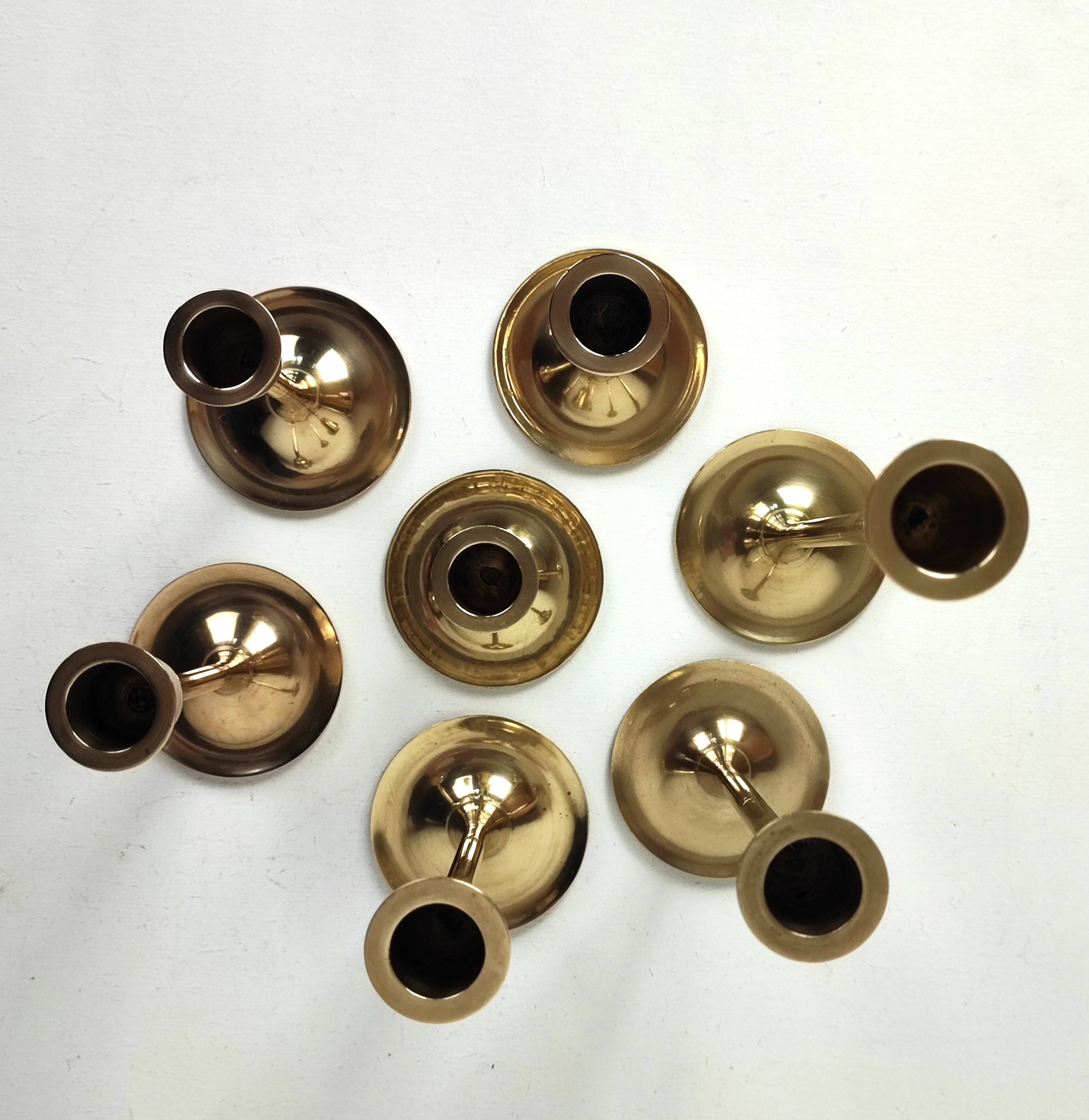 Set of 7 brass candlesticks