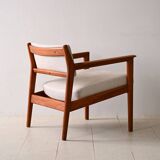 Upholstered armchair with teak frame