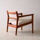 Upholstered armchair with teak frame
