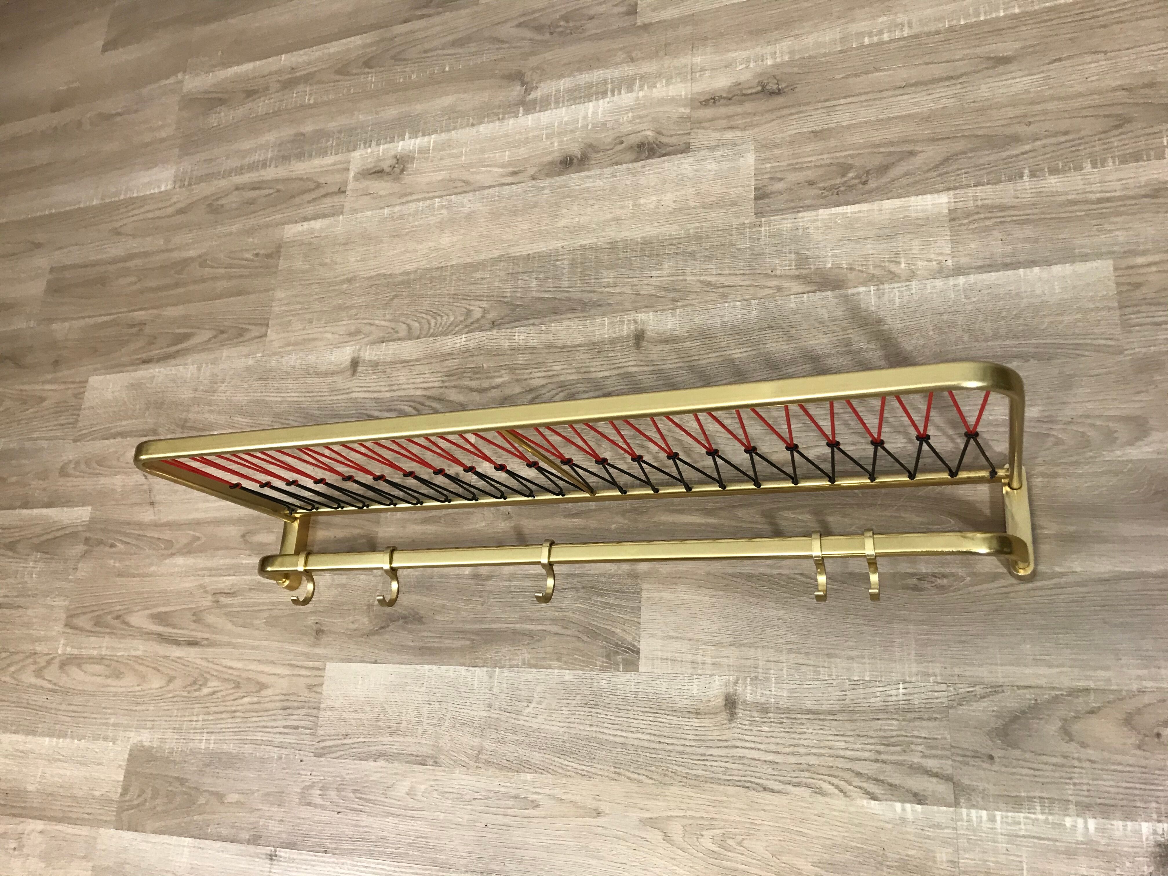 Coat rack with scoubidou shelf