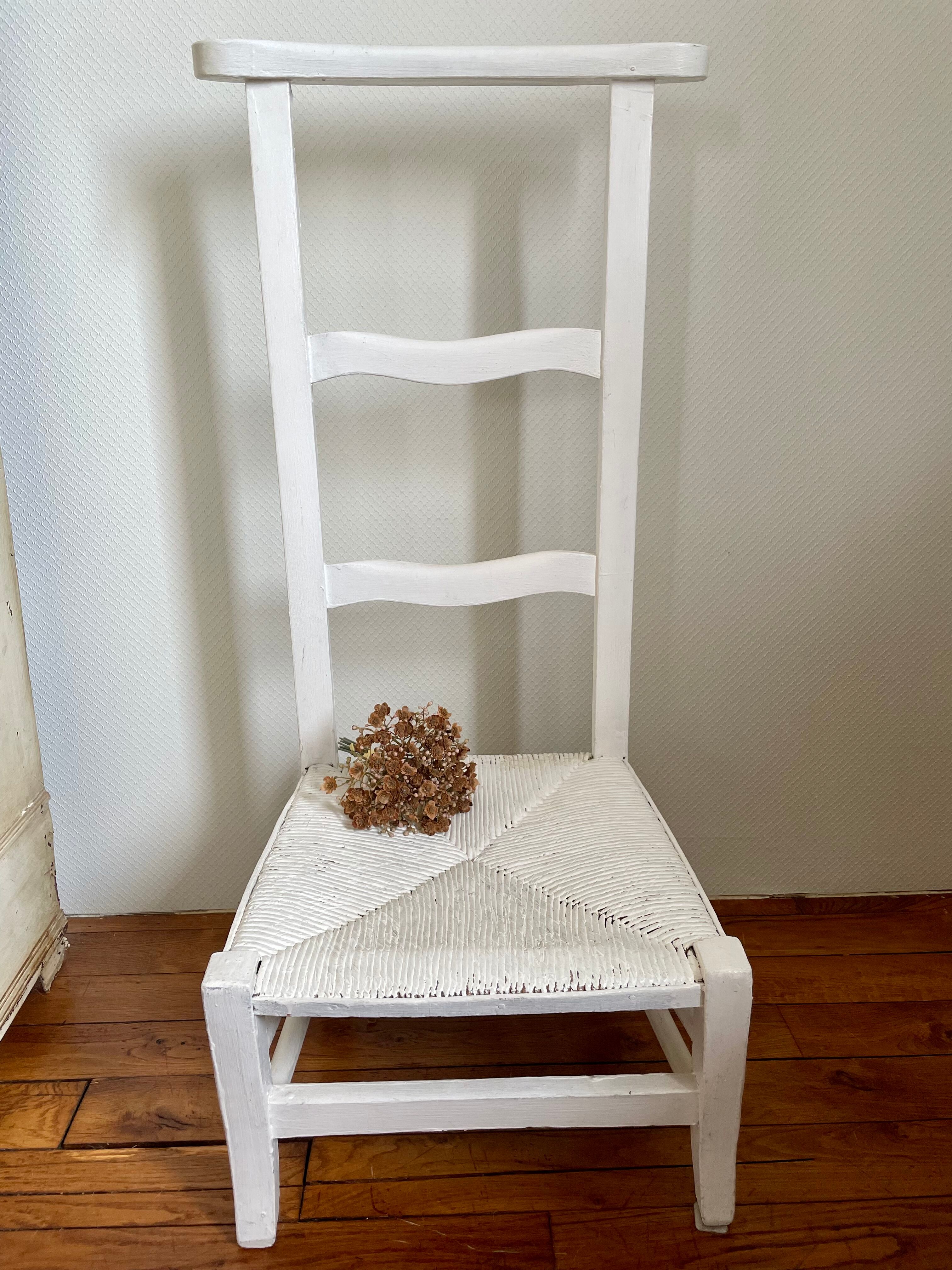 Old white mulched wooden chair